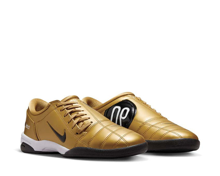 Buty piłkarskie z syntetycznej skóry w kolorze metalicznego złota.